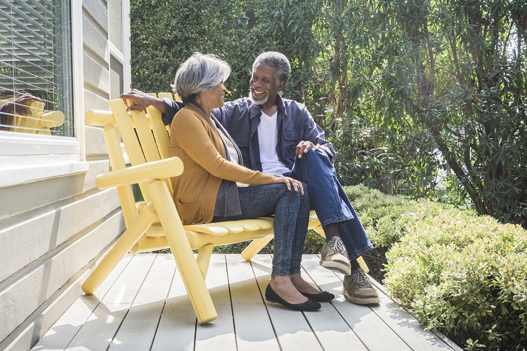older couple sitting on a porch