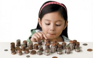 girl counting coins